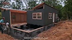 Setting a Double Wide 2 story cabin on a foundation. Esh's Storage Barns