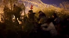 Hundreds of migrants camping at southern border cross into U.S. after cutting opening in razor wire