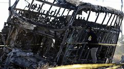 19 dead as double-decker bus smashes head-on into truck in fireball crash