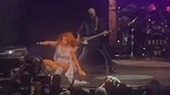 Shania Twain slips and falls performing live on-stage