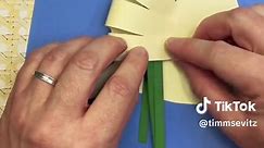 Easy Spring Paper Craft Tulip For Kids. Art project to make when you are feeling bored. Create a sentimental handprint card for moms, dads and grandparents with a glue stick, scissors and construction paper. Kids will love crafting this fun and easy craft. This is a fun art activity for little kids to make at school or a spring inspired party!