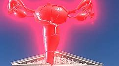 Artist Nancy Baker Cahill projects exploding uterus atop the US Supreme Court