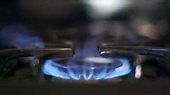 Stove top burner igniting into a blue cooking flame in slow motion 180fps. See my portfolio for other angles and slow motion speeds (60fps-180fps), including 4K UHD.