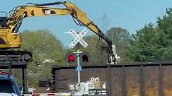 Check out this excavator unloading railroad ties on a moving train #build #howto #excavate #construction #DIY #contractor | House Plan