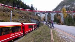 See world's longest passenger train run through Swiss Alps