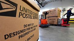 Postal service employees tackling the holiday rush as shipping deadlines loom