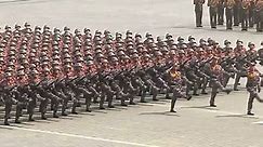 Soldiers take part in military parade during Day of the Sun