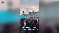 Crowd sings U.K. national anthem outside Buckingham Palace