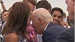 Biden nibbles little girl's shoulder on tarmac at Helsinki Airport