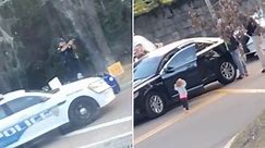 Footage shows toddler with hands raised during parents’ arrest