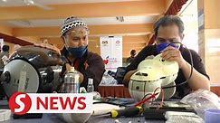 Technical college staff repairs flood-damaged electrical appliances for free - video Dailymotion