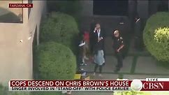 Chris Brown emerges from his house after hours-long standoff