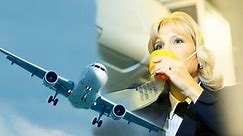 Flight attendant shows the proper way to use an oxygen mask