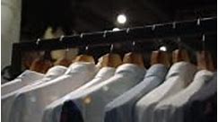 Footage scene of hanging clothes rack and rail on clothes hangers in...