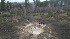 Drone video shows massive crater in Ukrainian forest after Russian missile strike