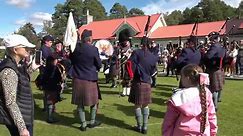 Perth Pipe Band march in playing Green Hills outside Pavilion during 2023 Braemar Gathering