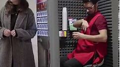 Man works in coffee vending machine...