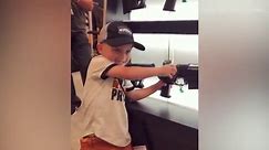 Four year old knows how to load a gun at gun show
