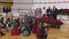 A confused Biden escorted offstage by young girl after Toys for Tots remarks