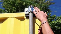 How to attach temporary fencing panels to a shipping container.