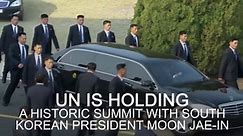Kim Jong-Un's official car flanked by 12 bodyguards running in formation