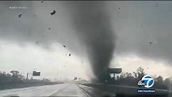 Video: Tornado whips across Texas interstate, sending debris flying and snapping power lines