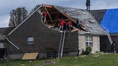 News Wrap: Storm system brings tornadoes to South and Midwest, snow to New England