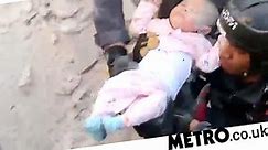 Baby girl rescued alive after four-storey building collapses on top of her