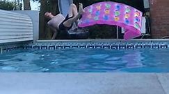 man tries to ride pool floatie down slide like a skateboard, falls, crashes and breaks his wrist