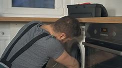 Professional Handyman Overalls Repairing Washing Machine Stock Footage Video (100% Royalty-free) 1023279250 | Shutterstock