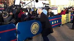 Biden fist-bumps members of the media during inaugural parade