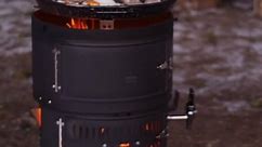 Outdoor BBQ combines pizza oven, rotisserie, smoker, and water boiler!