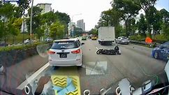 Motorbike fell after avoiding taxi changing lane