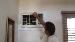 Cleaning a wall mounted air conditioning unit
