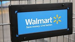 Walmart profit hit by workers’ raises