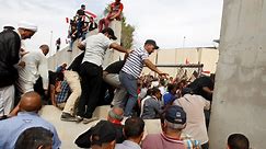 Baghdad is under a state of emergency after protesters stormed the parliament building in the heavily fortified Green Zone