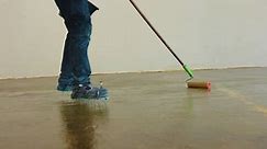 Industrial painter applies a primer layer of epoxy resin with the help of a needle stencil