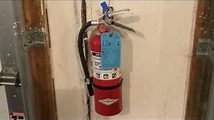 Installing a Fire Extinguisher on the Wall