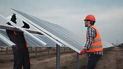 Two Workers Uniform Hardhat Install Photovoltaic Stock Footage Video (100% Royalty-free) 26001845 | Shutterstock
