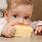 Baby Eating Cheese