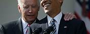 Barack Obama and Joe Biden Smiling AMD Raising Hands