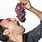 Person Eating Grapes