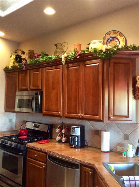 Tuscan Decorating above Kitchen Cabinets