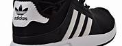 White Adidas Running Shoes with Black Stripes