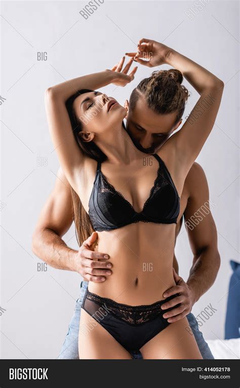 Men Kissing Breast Woman