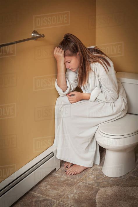 Woman Using Bathroom Toilet